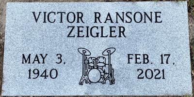 individual gray granite headstone with a drum set emblem